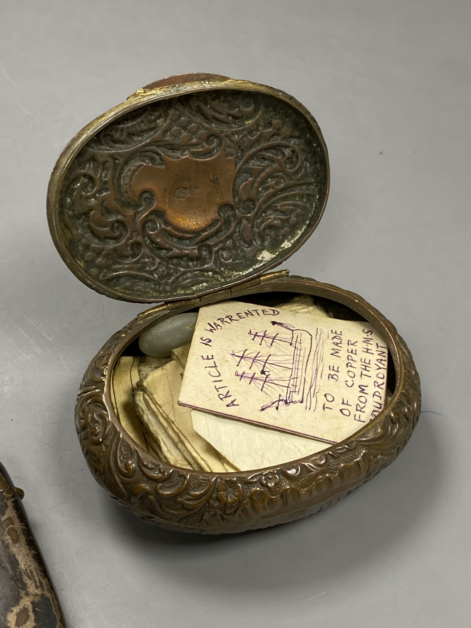 A Victorian oval commemorative snuff box, made from copper from HMS Foudroyant and a similar silver on copper vesta and chain